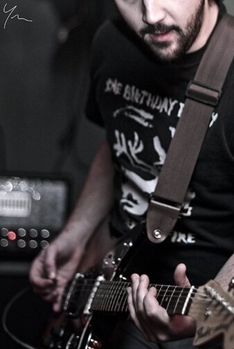 Guitar teacher performing